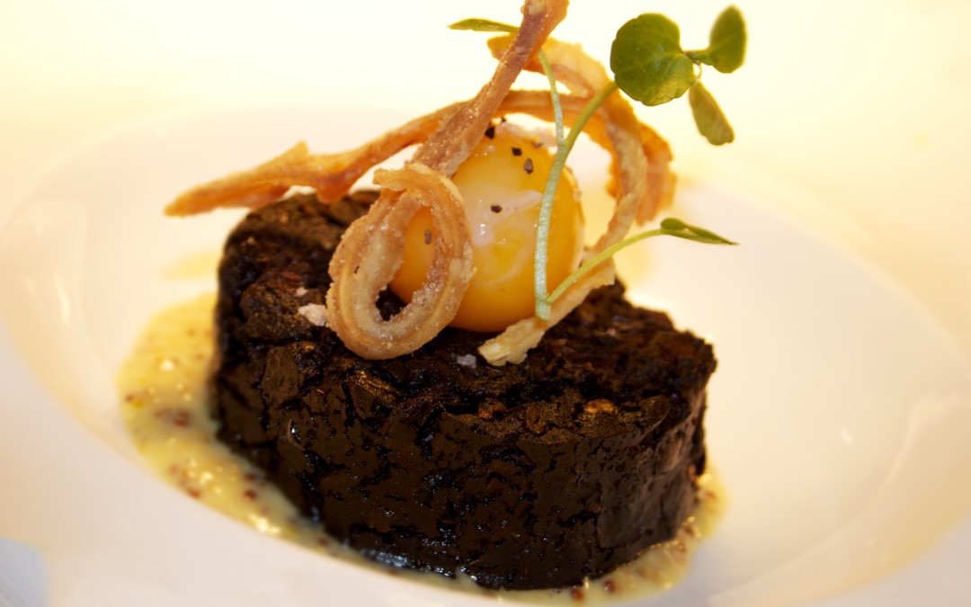 Heathcote's black pudding with slow cooked egg, crispy pig's ear and Pommery mustard purée